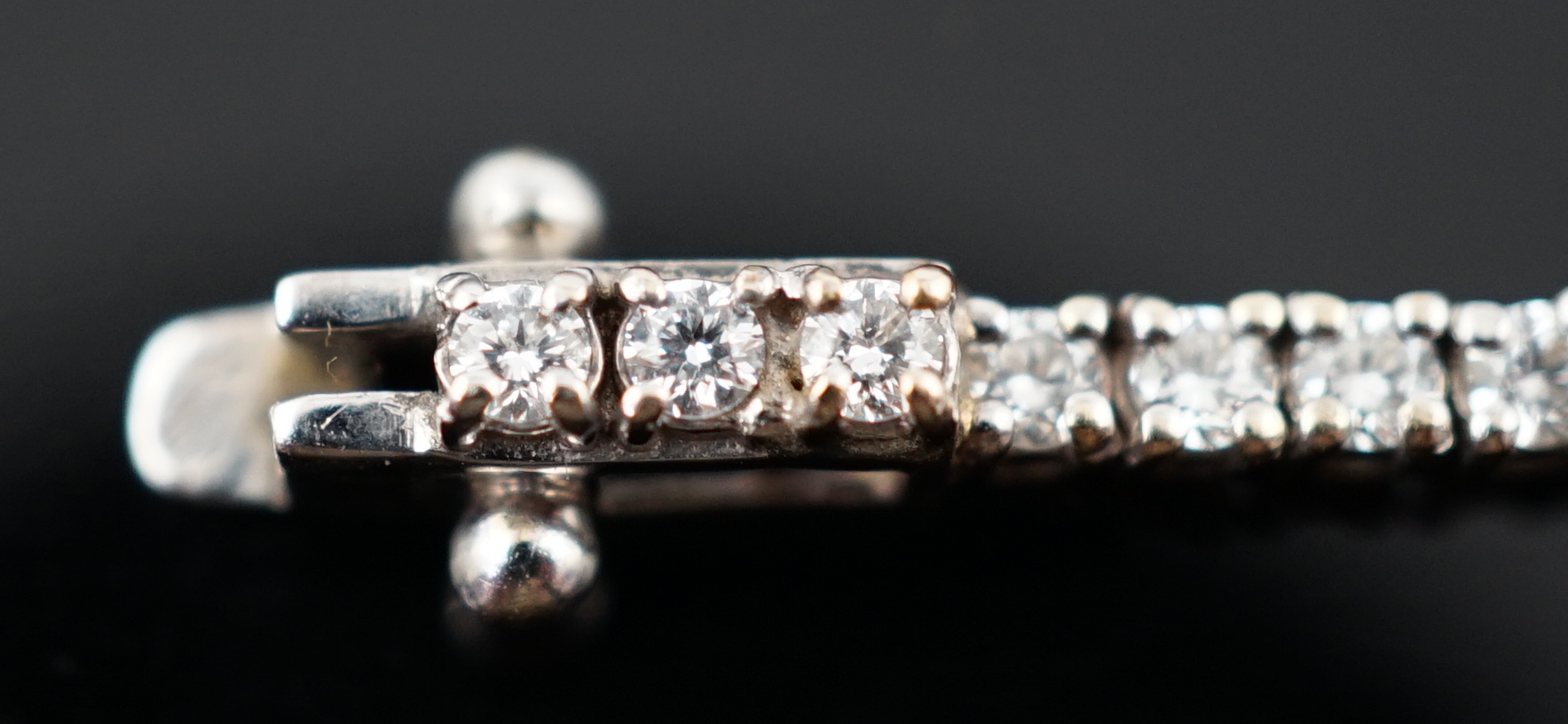 A modern 18ct white gold and diamond set line bracelet